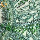 Il tessuto in rilievo verde sofisticato del pizzo/merletta il tessuto materiale per il vestito nuziale